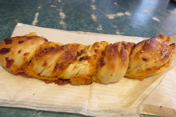 Warm and savory cheddar garlic bagel twists can be found at Maurice's Treats.