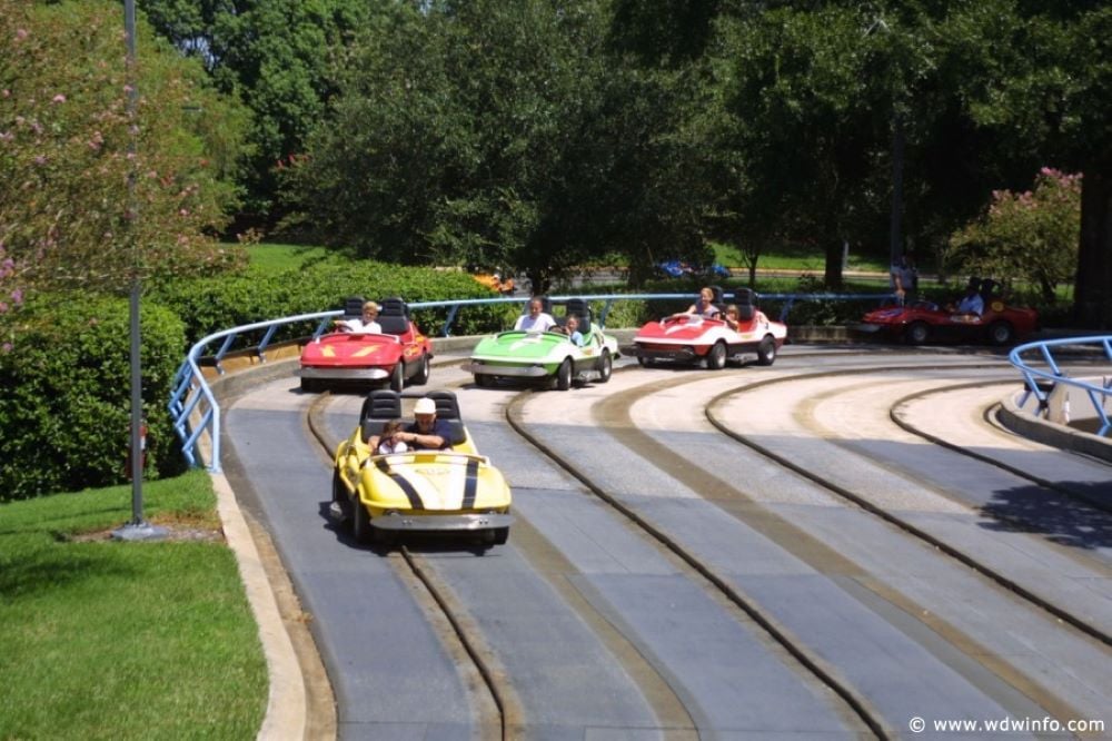 Photograph of cars being driven on the Tomorrowland Speedway track.