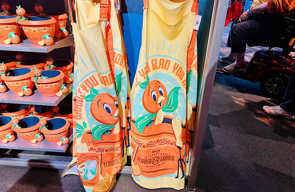 2024 FG Orange Bird Magic Apron โ WDWINFO.COM So Much NEW Orange Bird Merch at EPCOT! 2024 FG Orange Bird Magic Apron