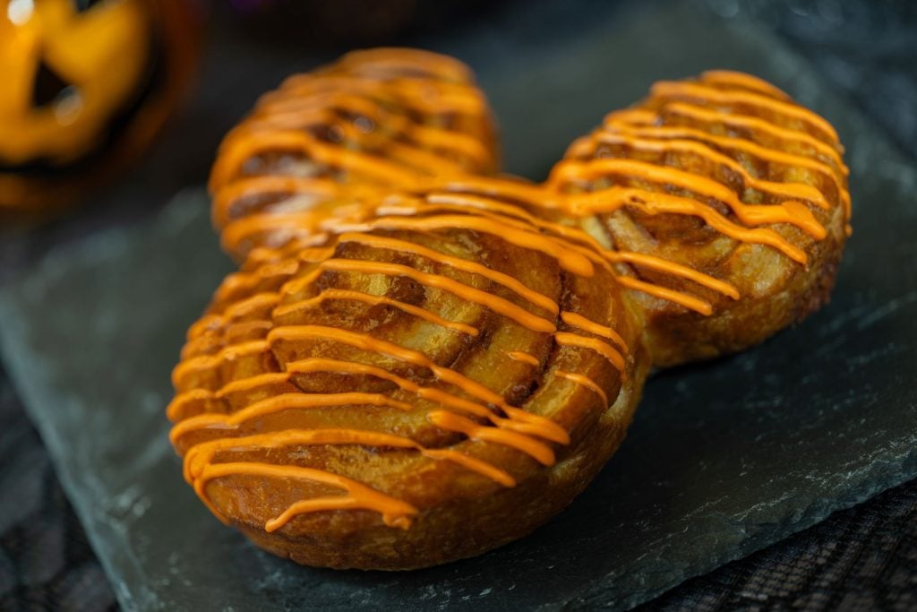Mickey-Cinnamon-Roll-Walt-Disney โ WDWINFO.COM New 2025 Halloween Snacks Coming to Walt Disney World Resort Hotels Mickey-Cinnamon-Roll-Walt-Disney