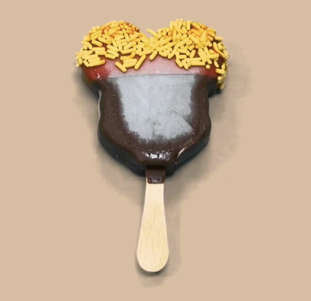 Dipped Mickey Bar 1 โ WDWINFO.COM Candy-Coated, Dipped Mickey Ice Cream Bars NOW Available at Disney World Dipped Mickey Bar 1
