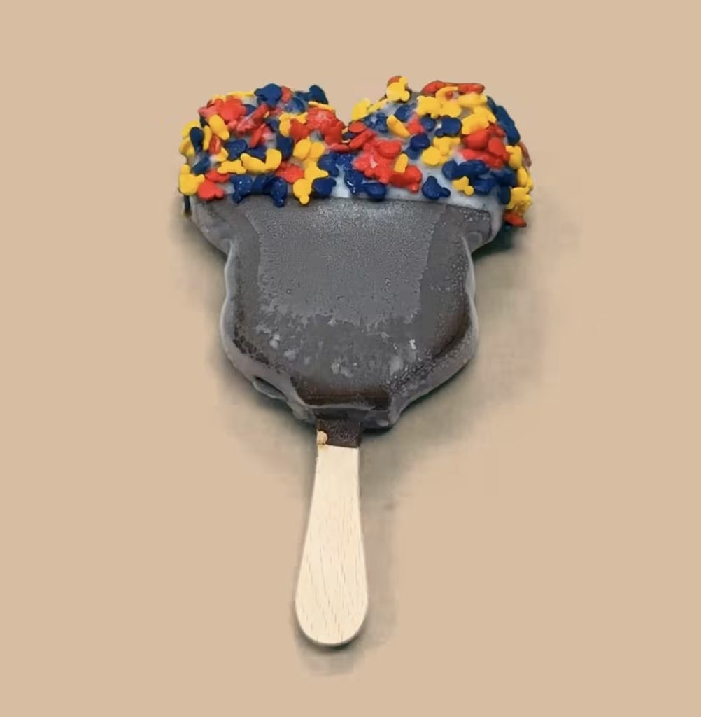 Dipped Mickey Bar 8 โ WDWINFO.COM Candy-Coated, Dipped Mickey Ice Cream Bars NOW Available at Disney World Dipped Mickey Bar 8