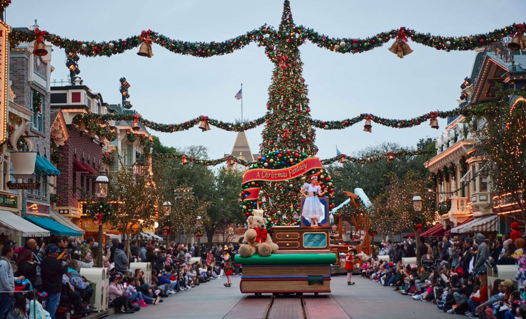 Disneyland Resort to Resume Sales of Inspire and Believe Magic Key Passes Nov. 4 disneyland-christmas-parade-main-st