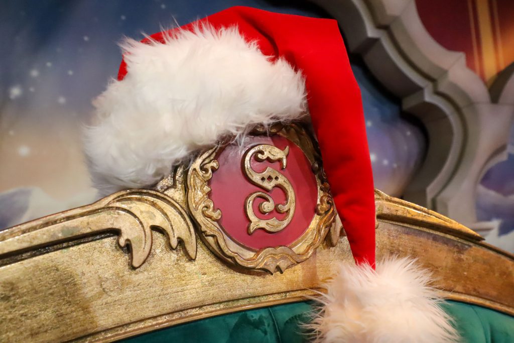 Your 2025 Guide to Meeting Santa at Walt Disney World 2025-santa-hat-chair-closeup