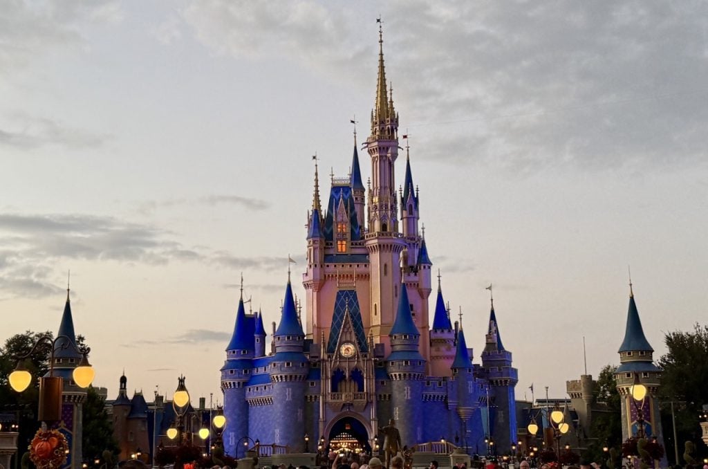 Why Your First Park Day Shouldn't Be A 'Do Everything' Day WDW Disney World Magic Kingdom Zoe Wood 2025 Cinderella Castle Dusk Sunset Large