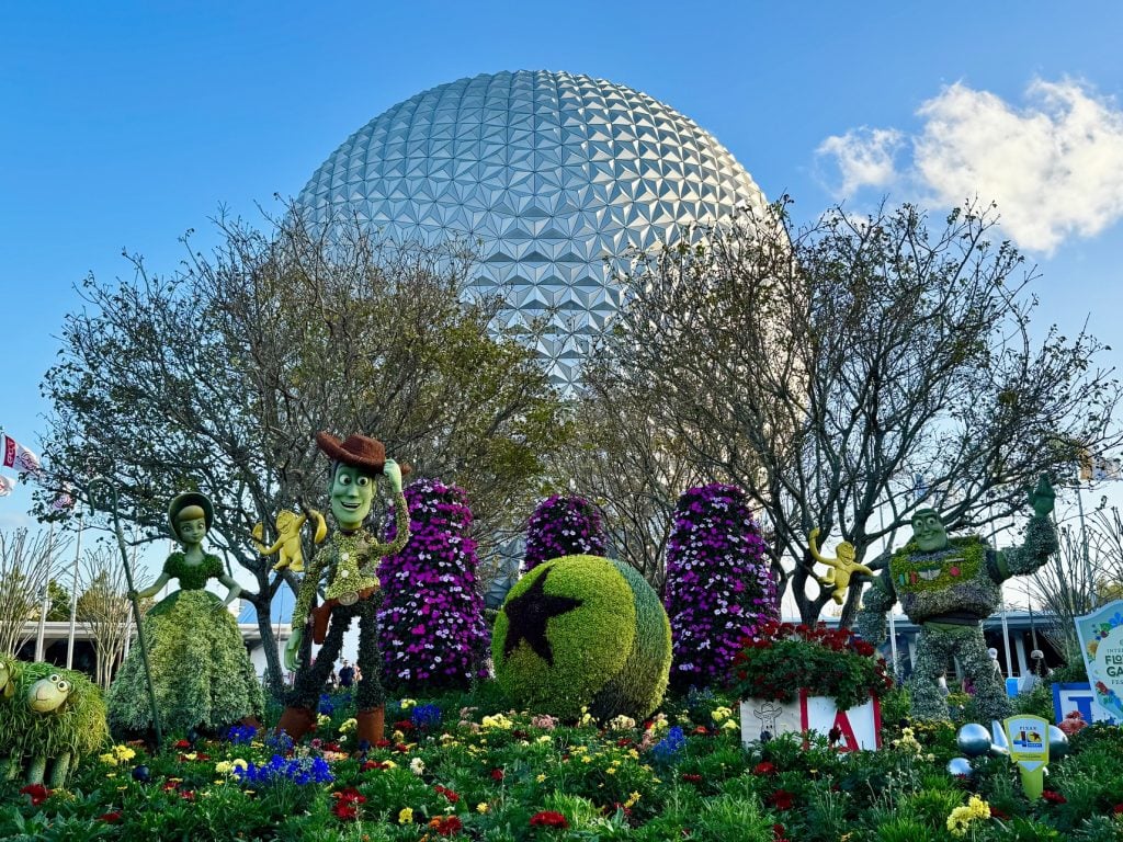 toy story topiaries_flower and garden 2025_epcot entrance_chloe – WDWINFO.COM EPCOT’s Entrance Has a New Look with No Trees or Festival Decor! toy story topiaries_flower and garden 2025_epcot entrance_chloe