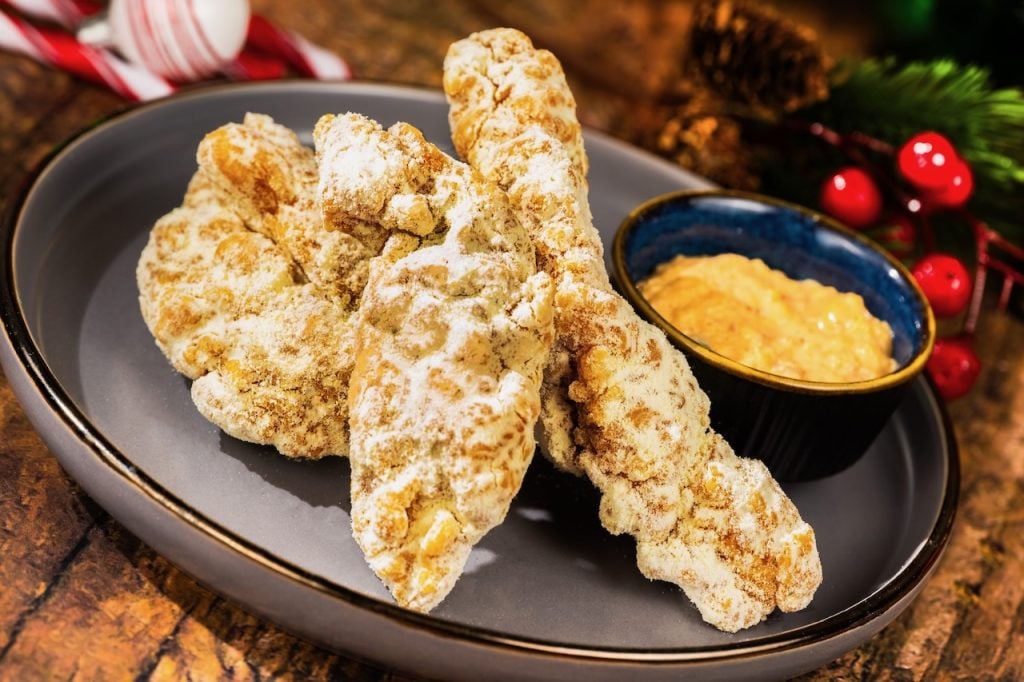 2026-WDW-MVMCP-Foodie-Guide-CheeseChickenStrips | WDWINFO.COM The 2026 Mickey’s Very Merry Christmas Party Foodie Guide is HERE! 2026-WDW-MVMCP-Foodie-Guide-CheeseChickenStrips