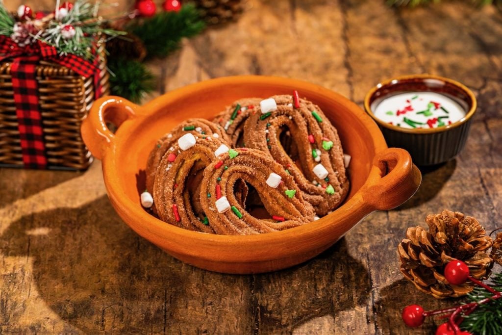 2026-WDW-MVMCP-Foodie-Guide-Churros | WDWINFO.COM The 2026 Mickey’s Very Merry Christmas Party Foodie Guide is HERE! 2026-WDW-MVMCP-Foodie-Guide-Churros