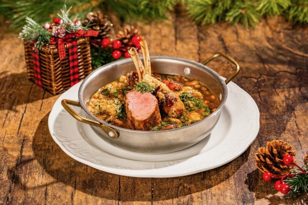 2026-WDW-MVMCP-Foodie-Guide-LambCassoulet | WDWINFO.COM The 2026 Mickey’s Very Merry Christmas Party Foodie Guide is HERE! 2026-WDW-MVMCP-Foodie-Guide-LambCassoulet