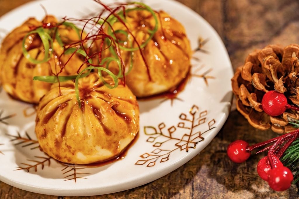 2026-WDW-MVMCP-Foodie-Guide-MongolianBeefBao | WDWINFO.COM The 2026 Mickey’s Very Merry Christmas Party Foodie Guide is HERE! 2026-WDW-MVMCP-Foodie-Guide-MongolianBeefBao