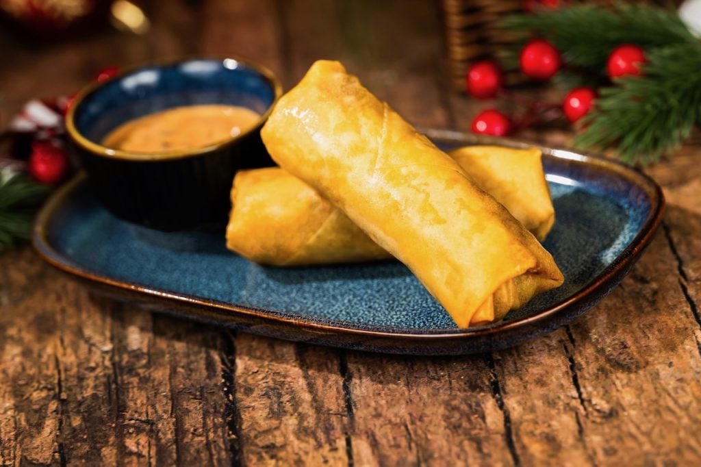 2026-WDW-MVMCP-Foodie-Guide-PastramiSpringRolls | WDWINFO.COM The 2026 Mickey’s Very Merry Christmas Party Foodie Guide is HERE! 2026-WDW-MVMCP-Foodie-Guide-PastramiSpringRolls