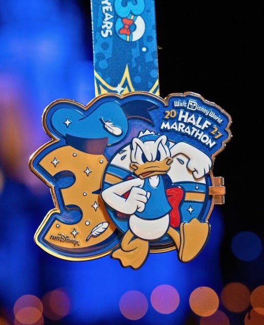 Screenshot | WDWINFO.COM FIRST LOOK: 2027 Walt Disney World Marathon Weekend Medals Revealed! Screenshot Screenshot