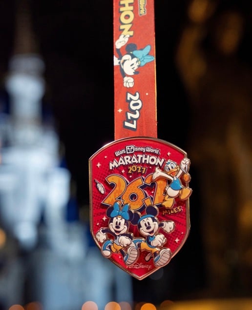 Screenshot | WDWINFO.COM FIRST LOOK: 2027 Walt Disney World Marathon Weekend Medals Revealed! Screenshot Screenshot